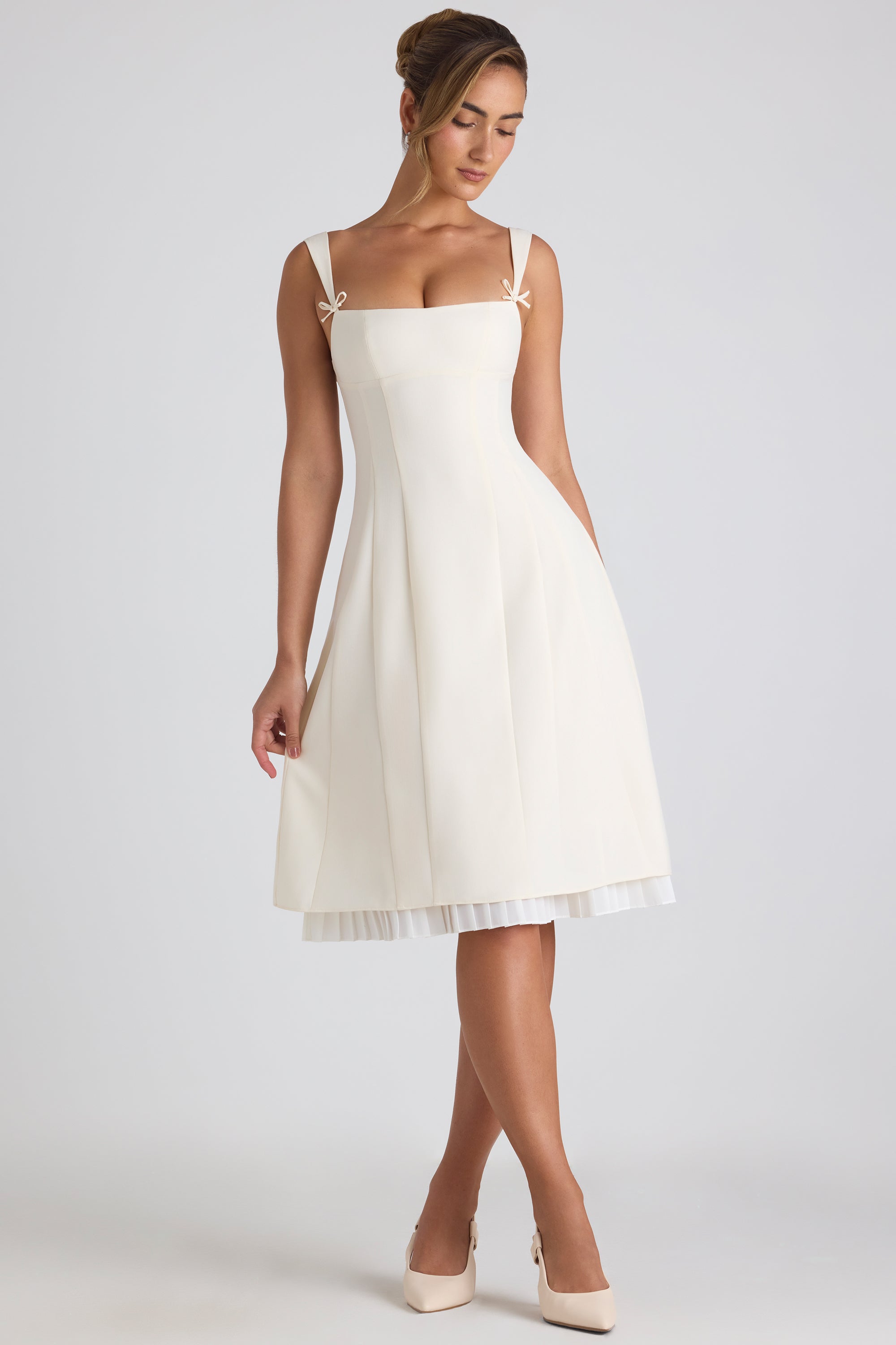Isadora Bow-Embellished Pleated A-Line Midi Dress in Ivory