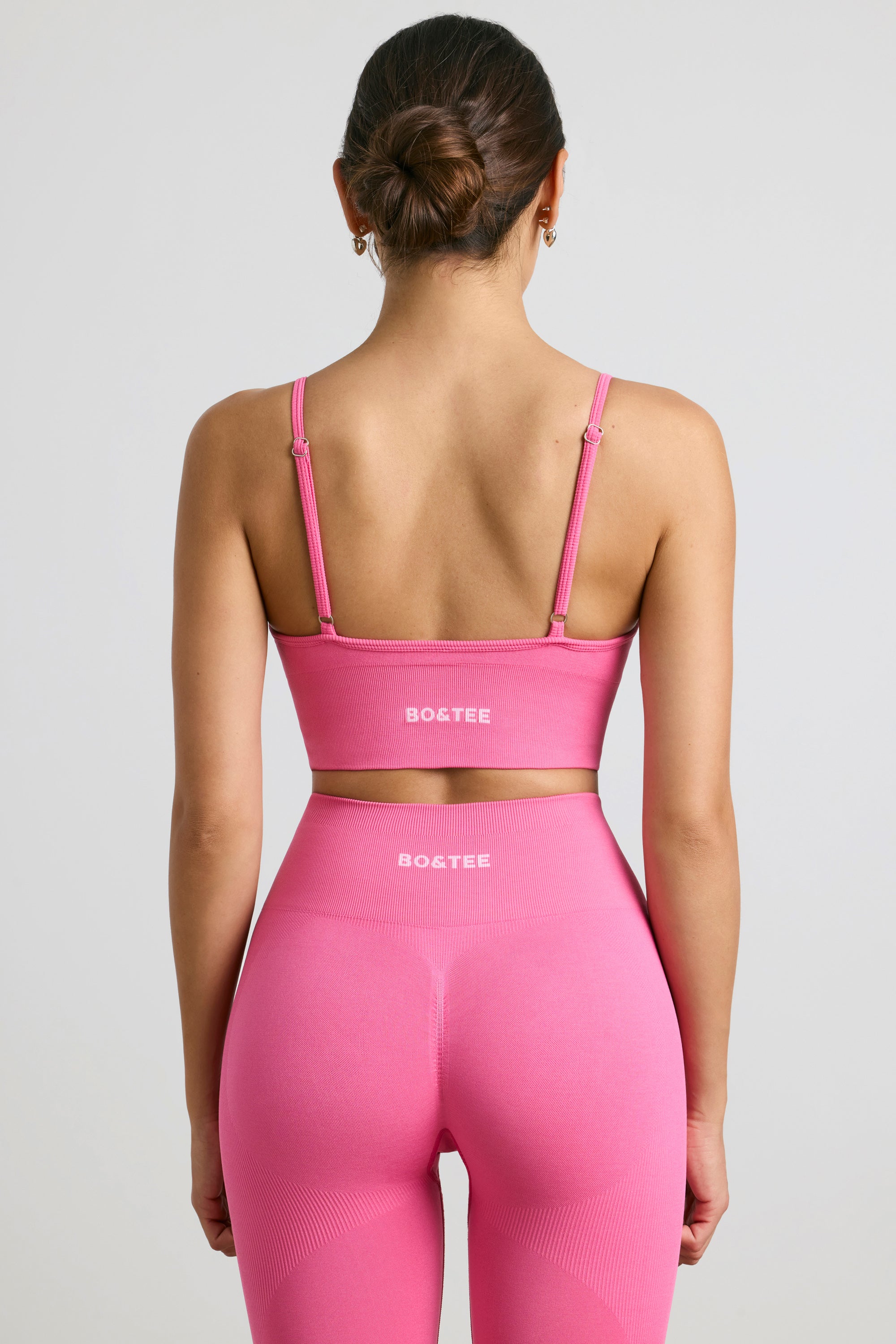 Exclusive V-Neck Define Luxe Sports Bra in Hot Pink