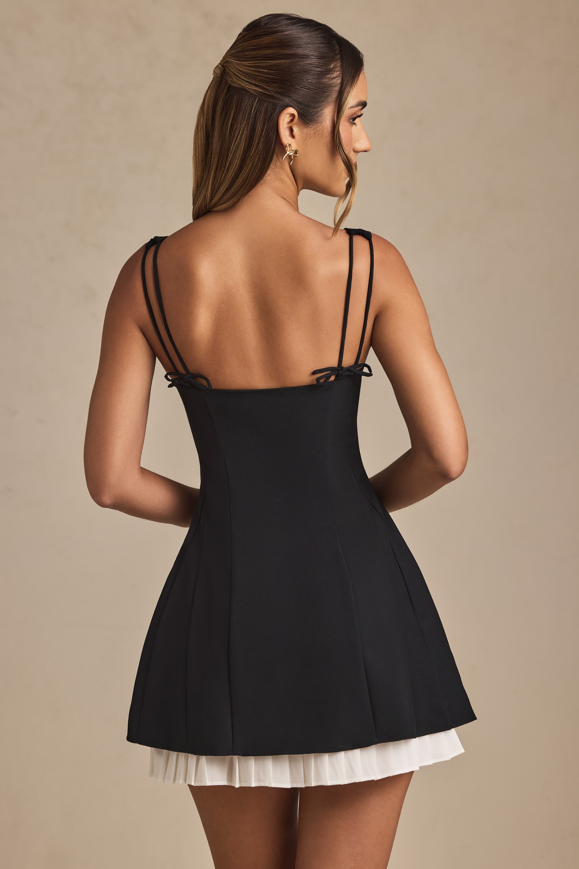 Cressida Bow-Detail Pleated A-Line Mini Dress in Black | Oh Polly
