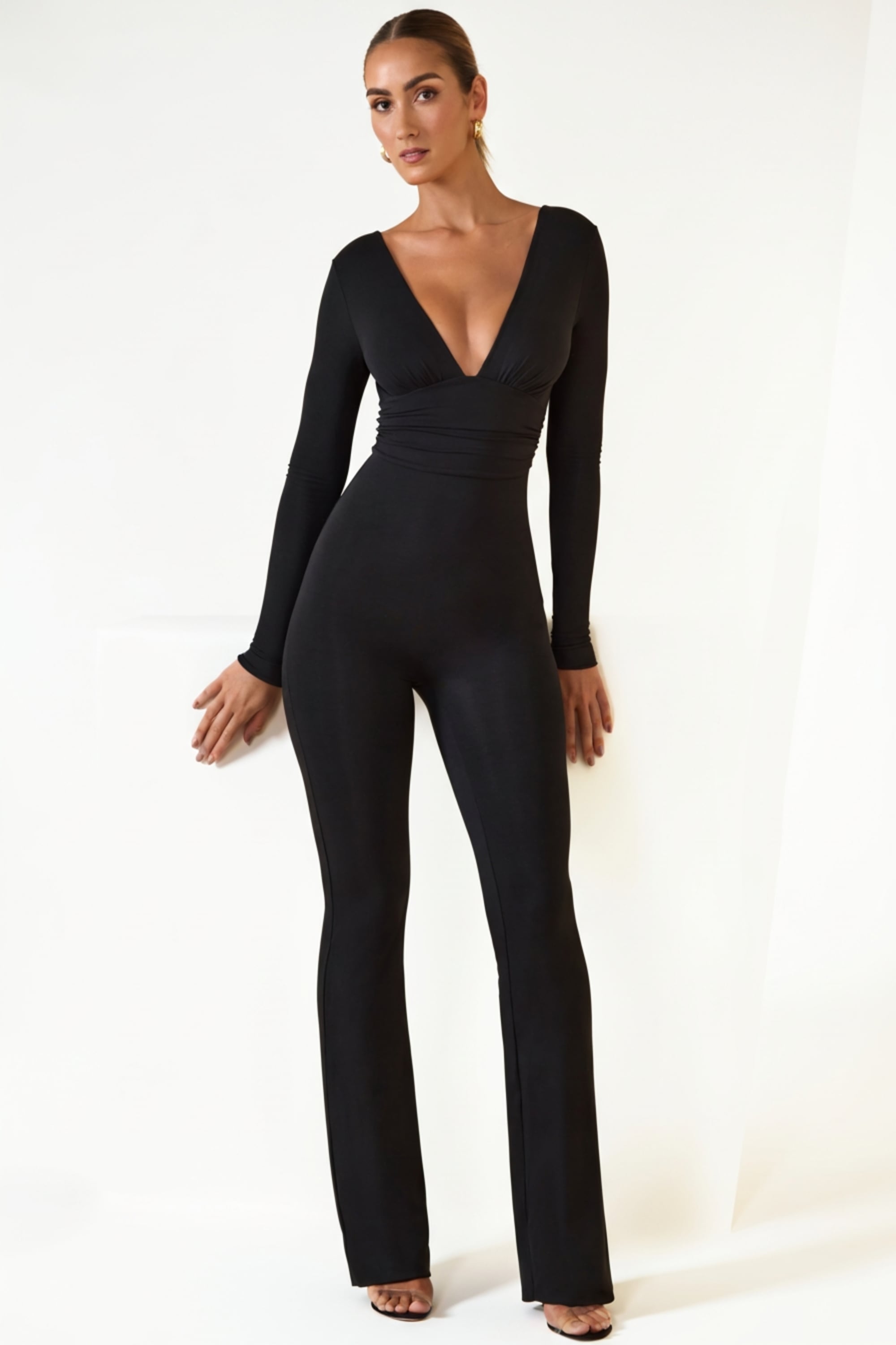 Helene Modal Ruched Plunge Flared Jumpsuit in Black | Oh Polly Helene Modal Ruched Plunge Flared Jumpsuit in Black | Oh Polly