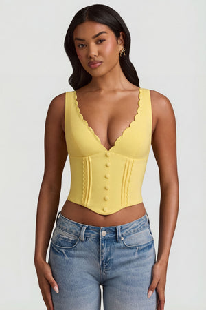 Oh Polly's Yarelis wearing the Lucia Corset Top in Pastel Yellow Stretch Woven fabric perfect for casual outings