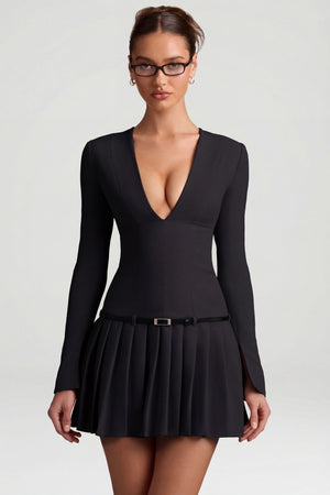 Oh Polly's Anna wearing the Fiorella Mini Dress in Black Stretch Woven fabric perfect for a night out
