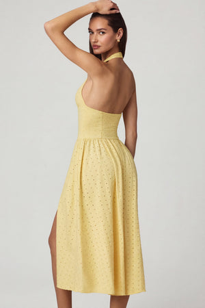 Oh Polly's Anna wearing the Farrah Maxi Dress in Lemon Yellow Cotton Jersey fabric perfect for casual date nights