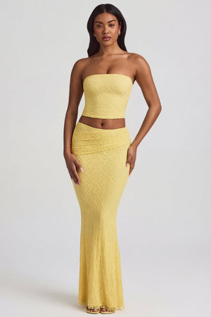 Oh Polly's Yarelis wearing the Vanda Maxi Skirt in Pastel Yellow Stretch Lace fabric perfect for summer garden parties