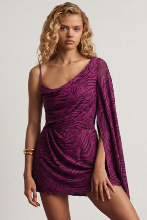Oh Polly's Juliana Nulu wearing the Angelie Mini Dress in Berry Purple Croc Jersey fabric perfect for clubbing events