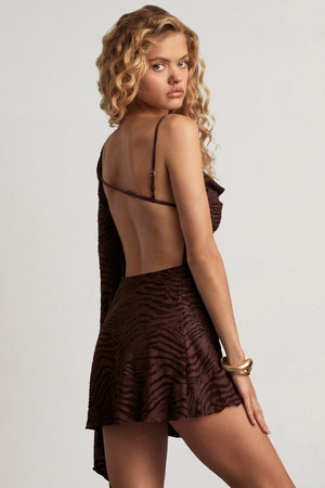 Oh Polly's Juliana Nulu wearing the Angelie Mini Dress in Dark Chocolate Burn Out Jersey fabric perfect for cocktail parties