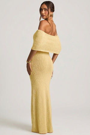 Oh Polly model Priscilla wearing the Naia Maxi Dress in Yellow Boucle Knit fabric perfect for daytime events