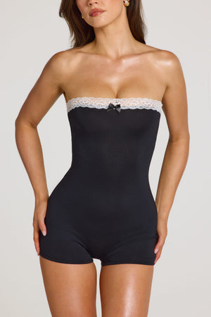 Oh Polly model Georgia wearing the Idalia Playsuit in Black Modal fabric perfect for weekend getaways