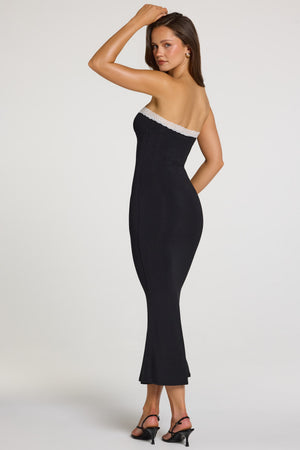 Oh Polly model Georgia wearing the Winslet Midaxi Dress in Black Modal fabric perfect for wedding guests