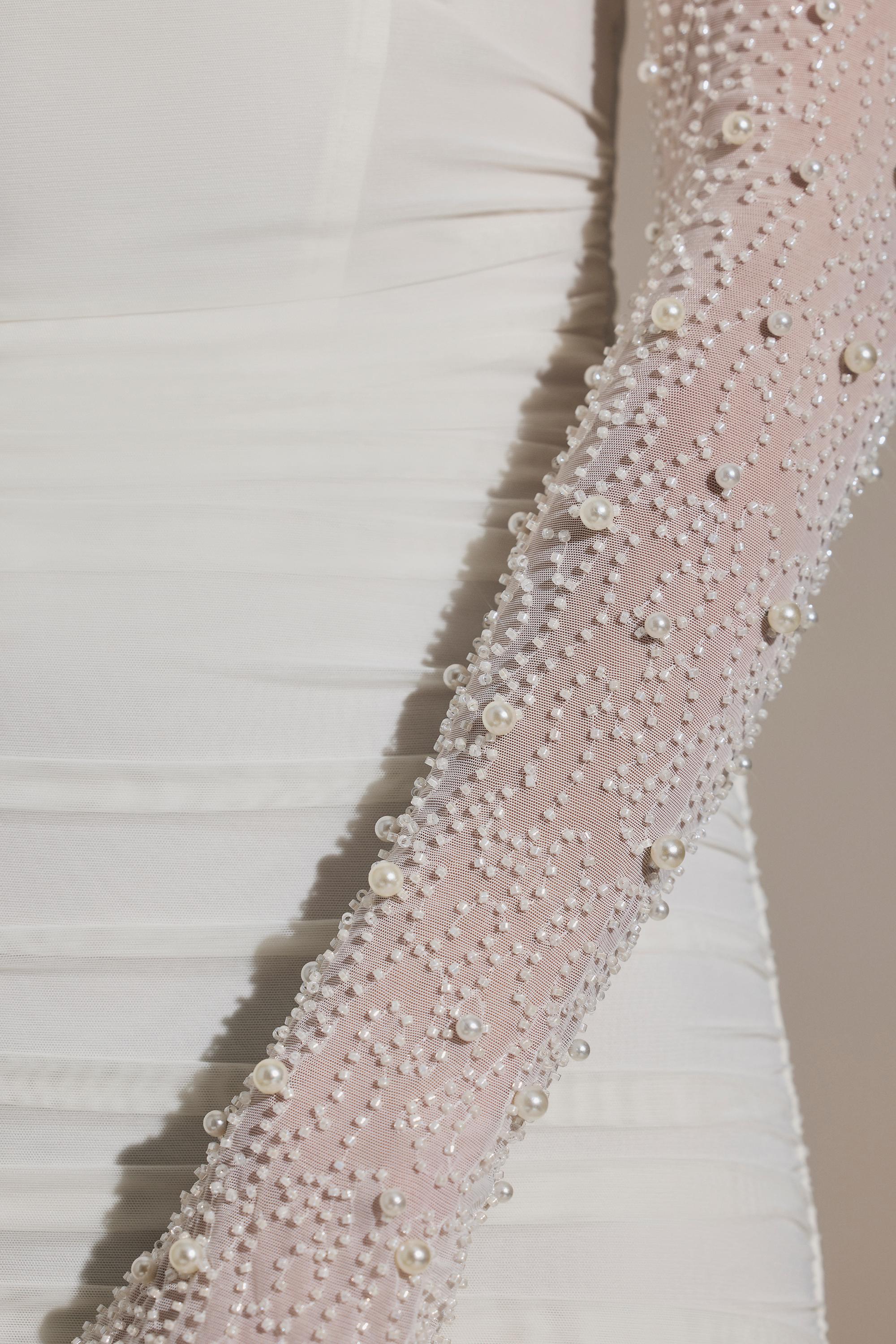 white dress with pearl sleeves Modern Lace Satin Wedding Long Sleeve Pockets May be worn with a strapless bra Pearl-Embellished Square Neck Maxi Dress