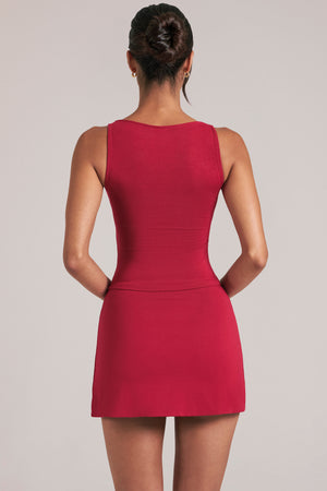 Oh Polly model Yasmin wearing the Tula Mini Skirt in Cherry Red Modal fabric perfect for summer parties