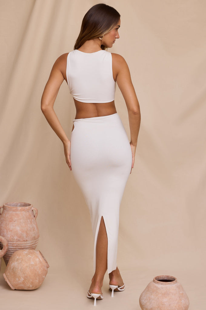 Falda larga torcida de talle medio en blanco