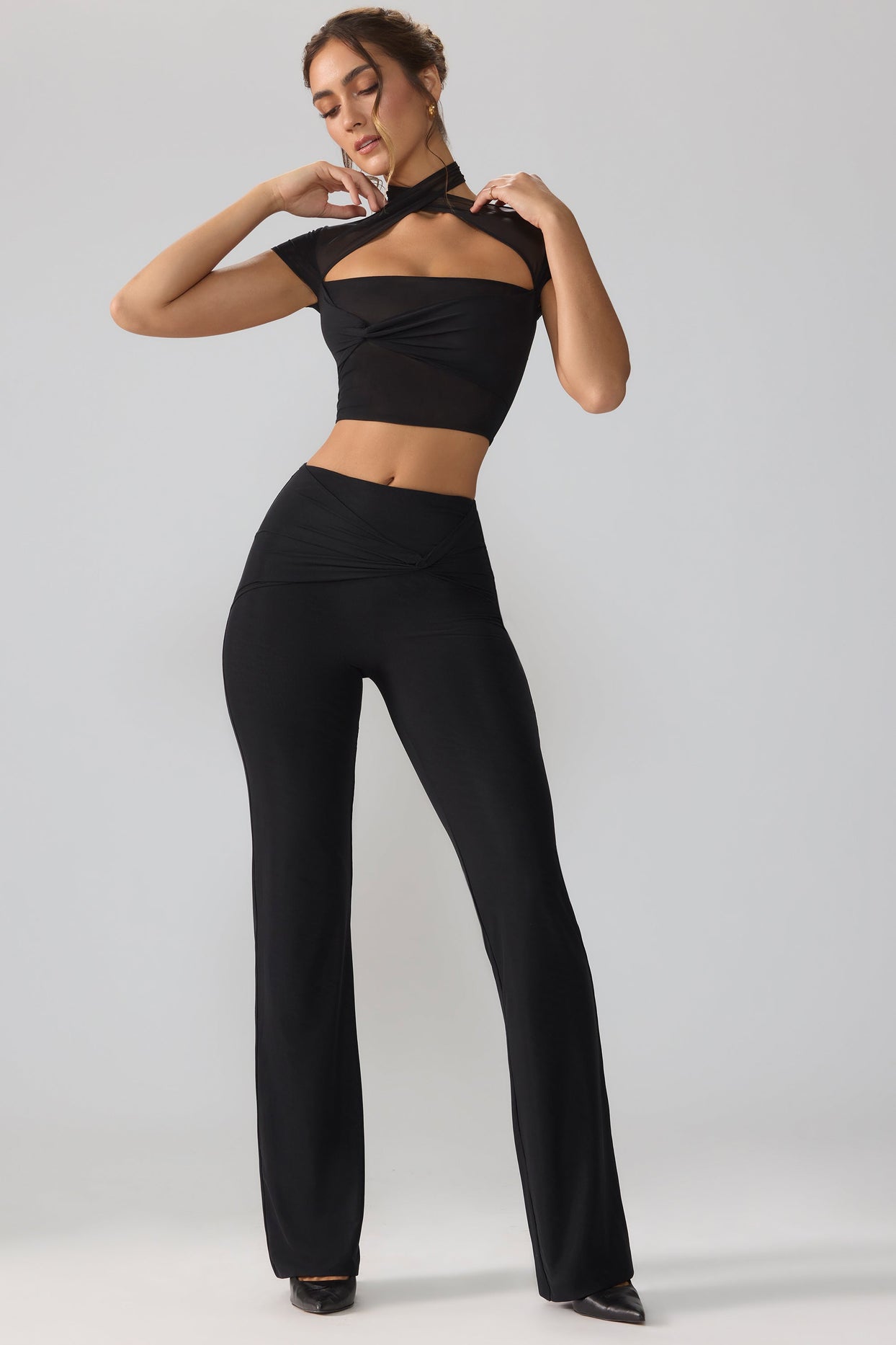 Ridley Mesh Mid Rise Twist Overlay Flare Trousers in Black | Oh Polly
