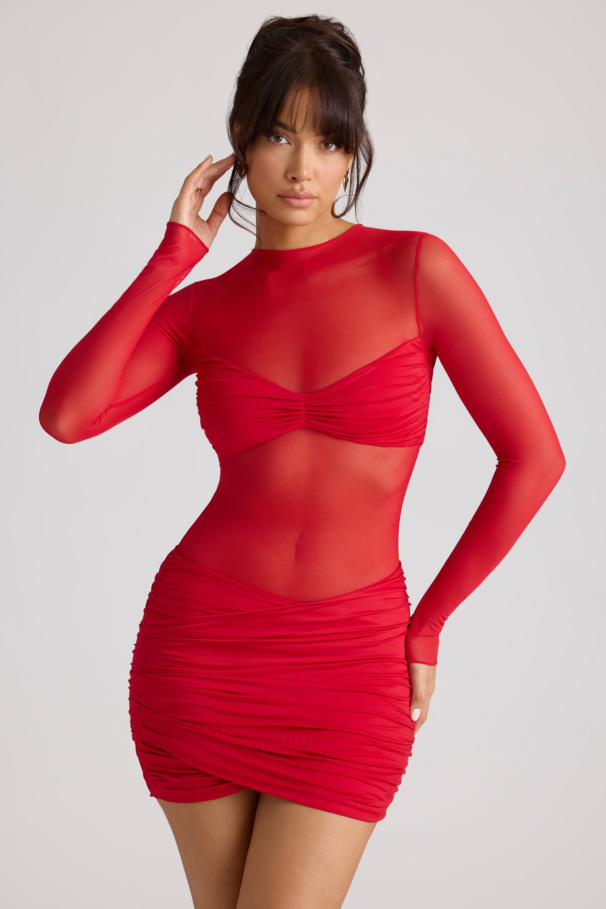 Minivestido de manga larga con paneles transparentes en rojo fuego