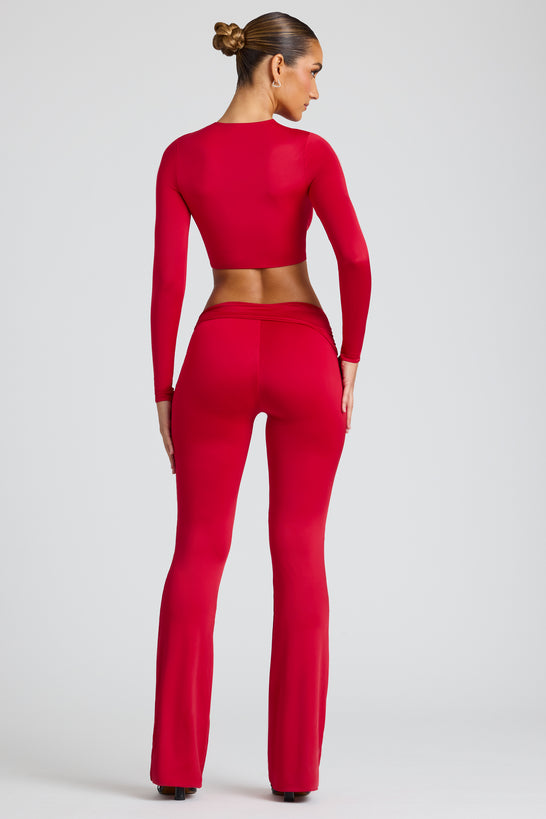 Pantalones de pernera recta con detalle drapeado en rojo fuego