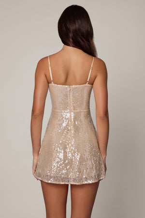 Oh Polly's Roberta wearing the Agnetha Mini Dress in Pale Peach Sequin, Lace fabric perfect for summer parties