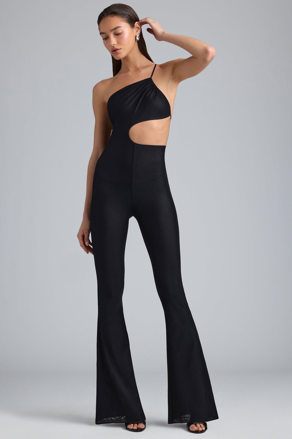 Amara Metallic Ruched Cut-Out Flared Jumpsuit in Black | Oh Polly