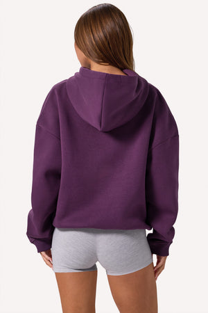 Bo+Tee model Lydia Butler wearing the CosyCoffeeRunWithLydsButler Hoodie in Plum Brushback sweat fabric perfect for gym commutes