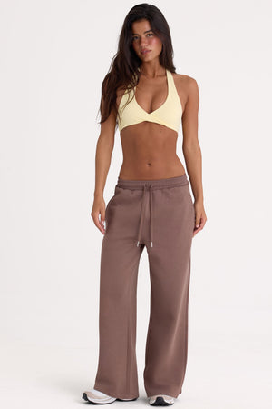Bo+Tee model Lydia Butler wearing the CosyCoffeeRunWithLydsButler Joggers in Cocoa Brushback sweat fabric perfect for weekend lounging