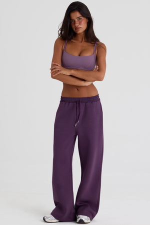 Bo+Tee model Lydia Butler wearing the CosyCoffeeRunWithLydsButler Joggers in Plum Brushback sweat fabric perfect for morning coffee runs