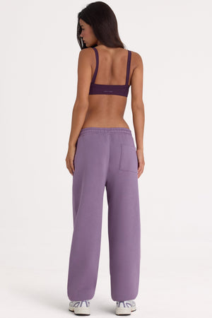 Bo+Tee model Lydia Butler wearing the CosyCoffeeRunWithLydsButler Joggers in Dusk Brushback sweat fabric perfect for cozy home lounging