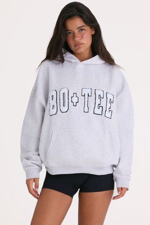 Bo+Tee model Kiele wearing the Off-Duty Hoodie in Heather Grey Cotton fabric perfect for casual outings