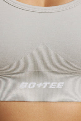 Sujetador deportivo Define Luxe con cuello halter en gris claro