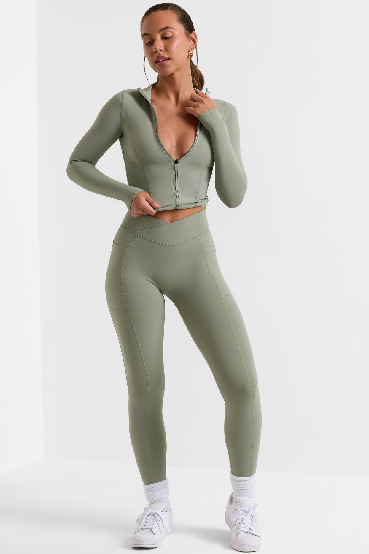 Leggings pequeños de cuerpo entero con bolsillos en verde bambú