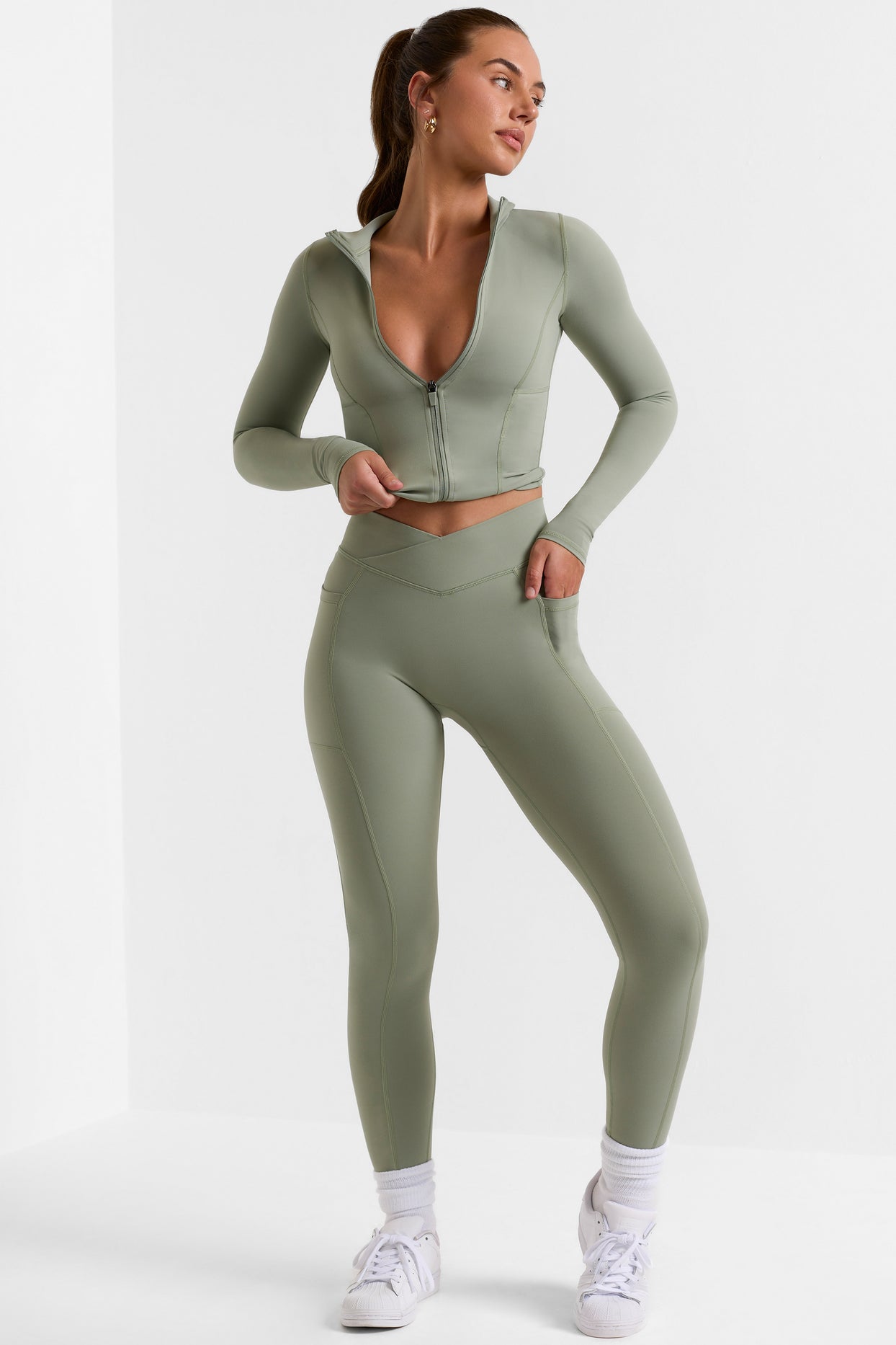 Leggings pequeños de cuerpo entero con bolsillos en verde bambú