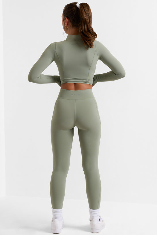 Leggings pequeños de cuerpo entero con bolsillos en verde bambú