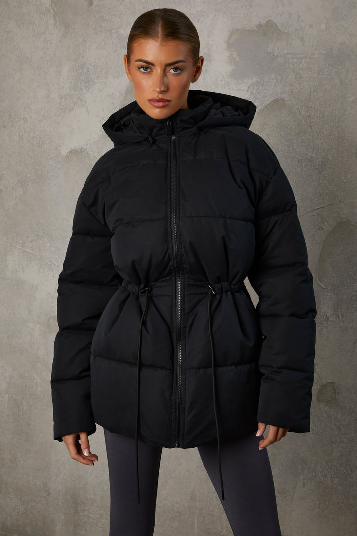 Snug Mid Length Hooded Puffer Coat in Black | Oh Polly