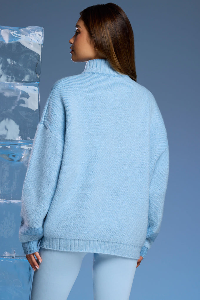 Suéter grande de malha grossa com meio zíper em azul bebê