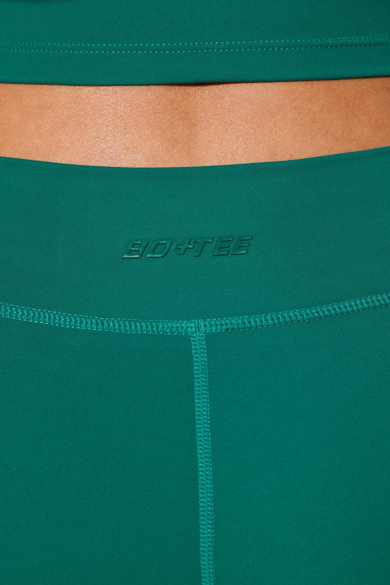 Mini Shorts con cintura torcida y bolsillos en verde azulado