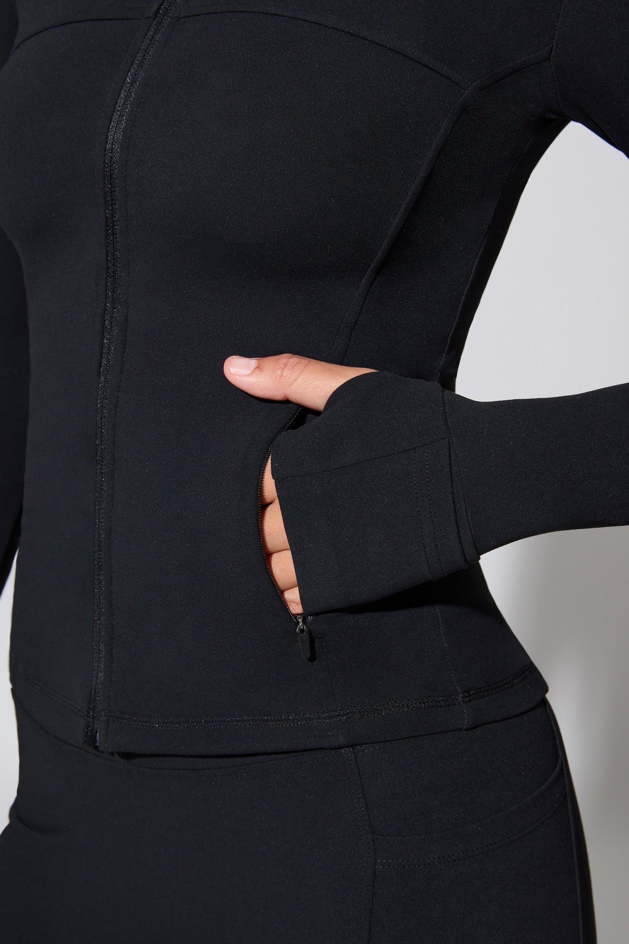 Growing Long Sleeve Zip Up Jacket With Side Pockets in Black | Oh Polly