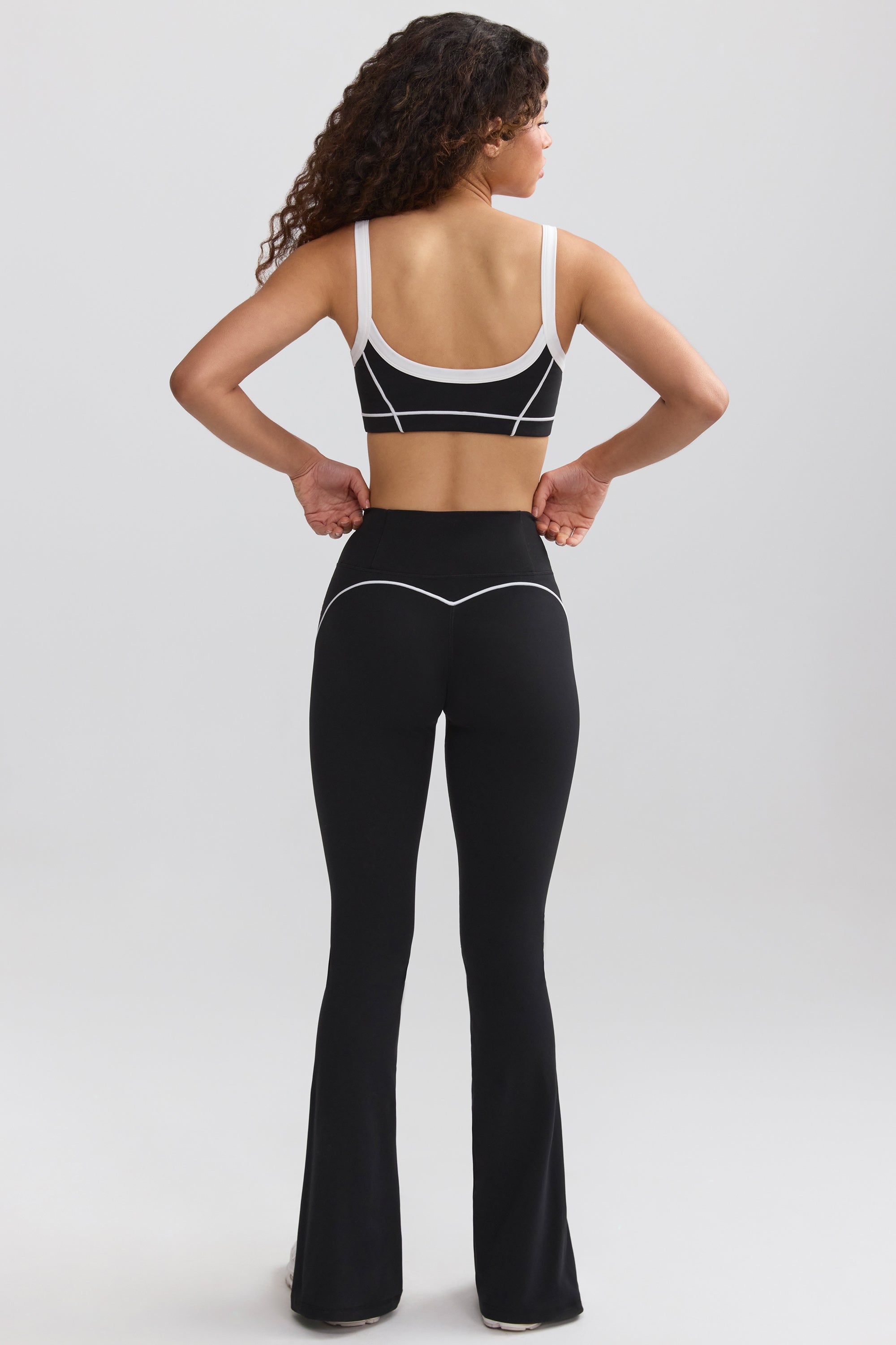 Petite Soft Active Contrast-Trim Flared Trousers in Black