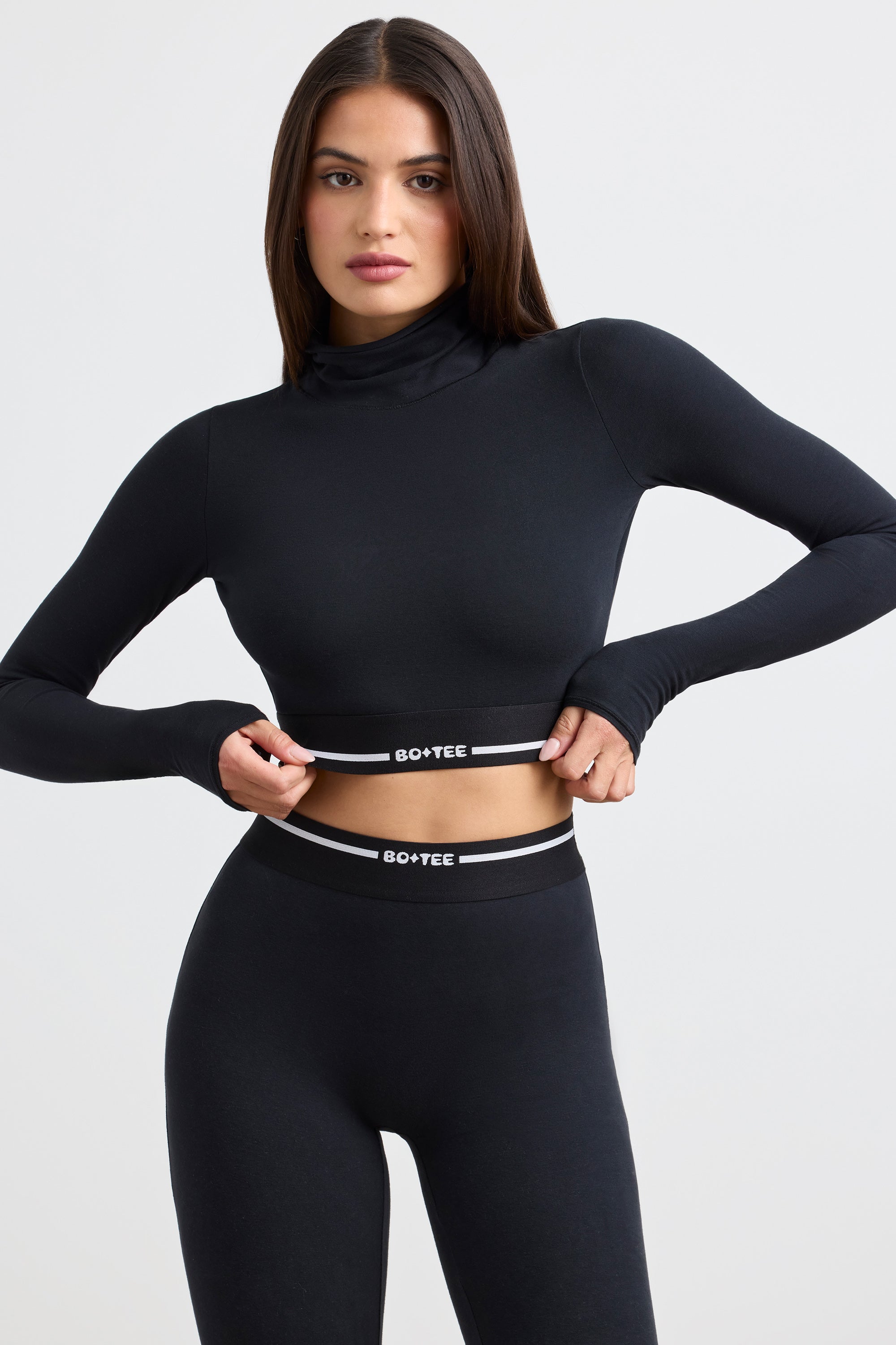 Grounded Turtleneck Backless Long-Sleeve Crop Top in Black | Oh