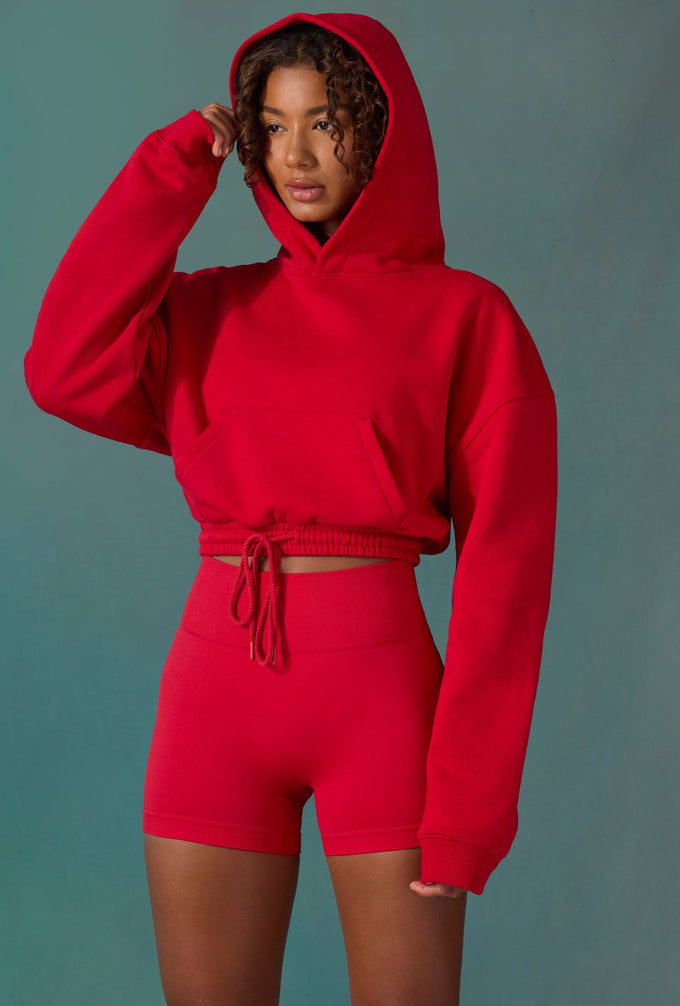 Cropped Drawstring Hooded Sweatshirt in Tango Red
