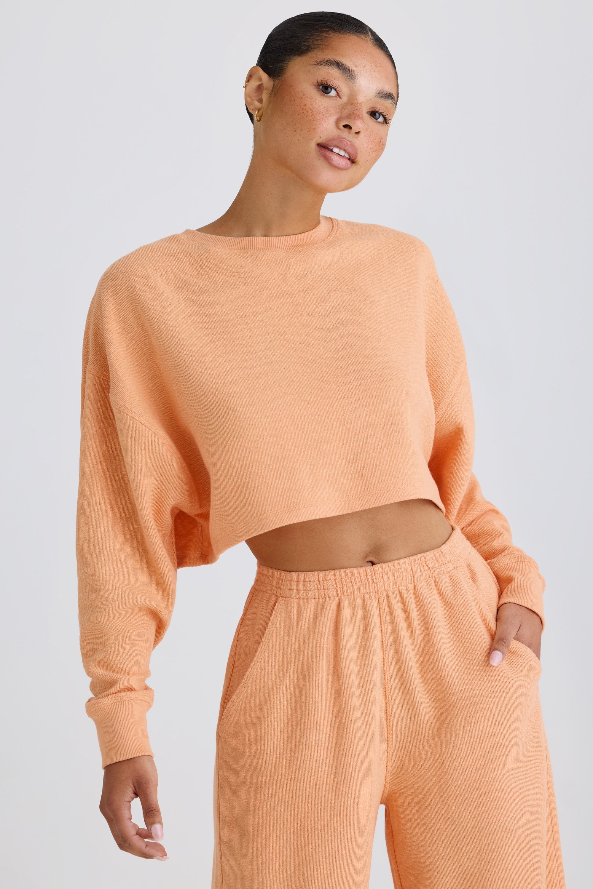 Crew-Neck Open-Back Cropped Sweatshirt in Peach