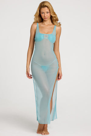 Oh Polly Swim's Bella wearing the Pacifica Maxi Dress in Turquoise fabric perfect for beachside brunches