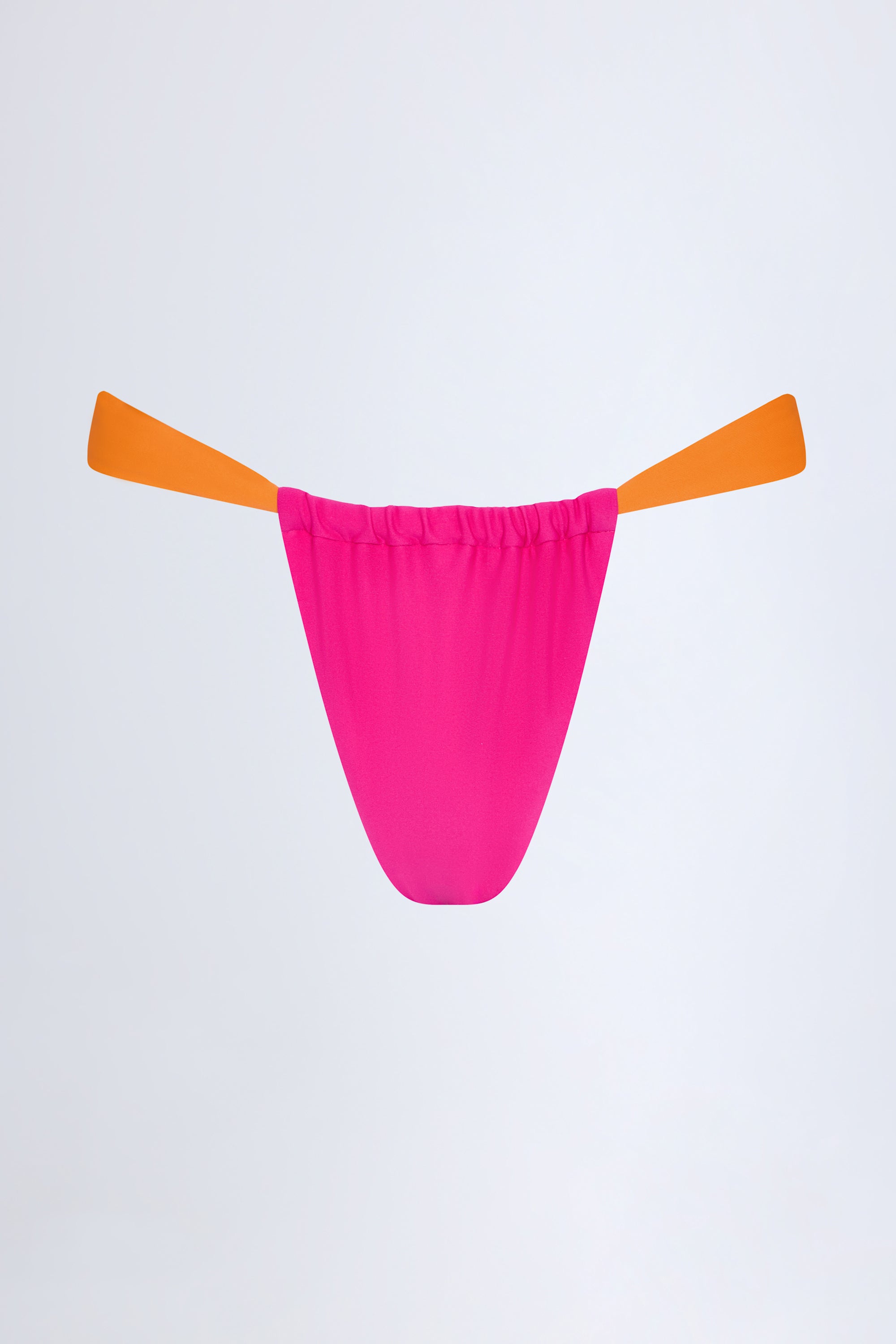 水玉模様のピンクのCHEEKY　PUNKIE DOTTY Pensacola Cheeky Bikini Bottoms in Fuchsia | Oh Polly