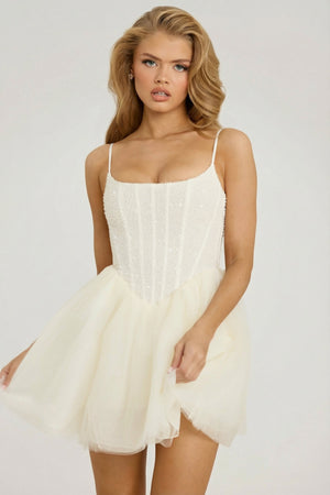 Oh Polly's Josey Anne wearing the Eugenie Mini Dress in White Embellished, Tulle fabric perfect for holiday gatherings