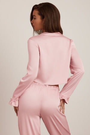 Oh Polly's Hayley wearing the Aimi Full Top in Baby Pink Satin fabric perfect for summer garden parties