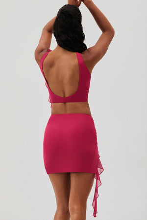 Oh Polly's Yarelis wearing the Airlie Mini Skirt in Fuchsia Mesh fabric perfect for clubbing events