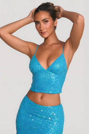 Oh Polly's Priscilla wearing the Anaise Full Top in Turquoise Sequin fabric perfect for birthday celebrations