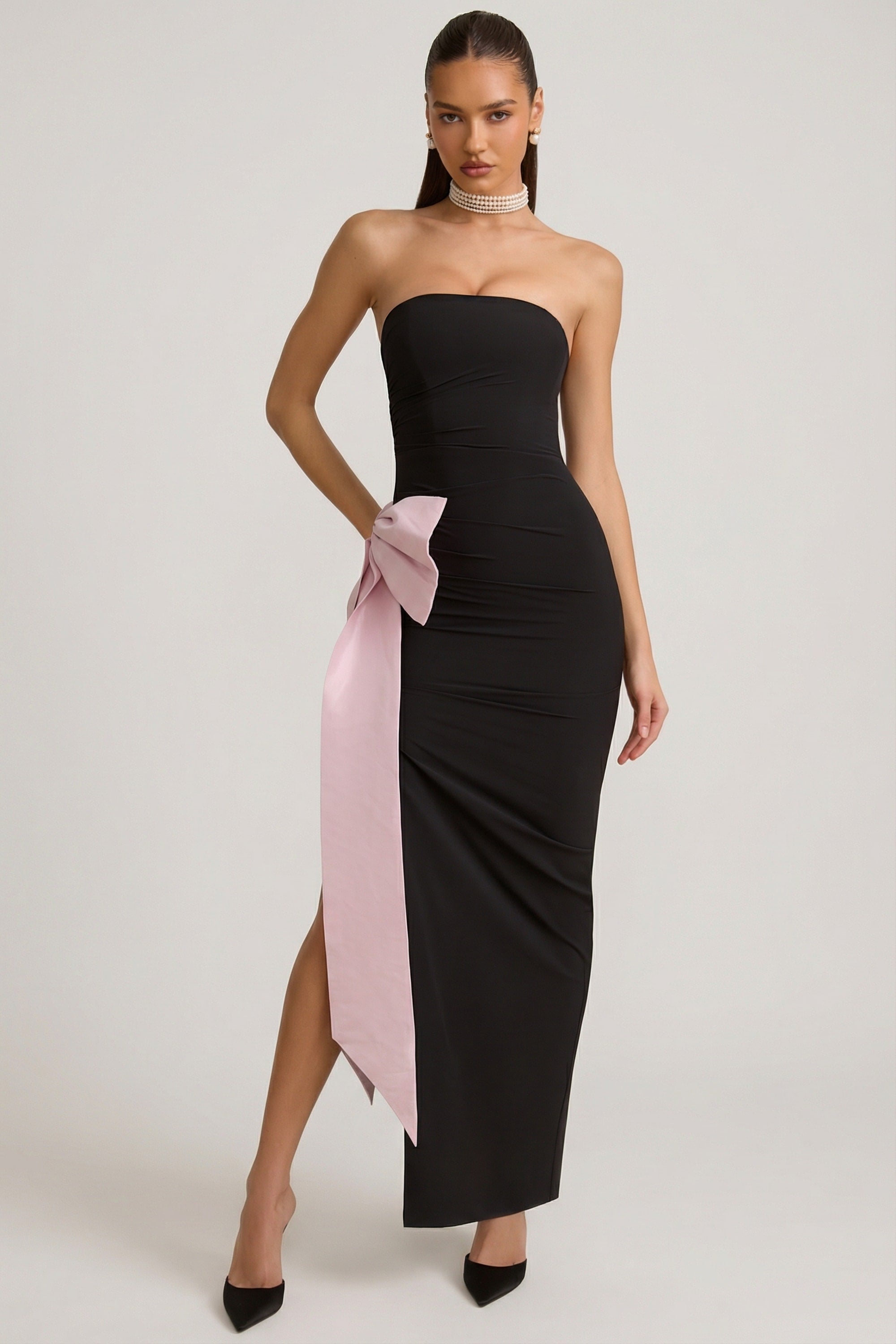 black dress with pink bow PS24010 8 / Black strapless mini with pink bow cutouts down center front Front Big Bow Suspender Dress