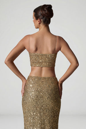 Oh Polly's Anna wearing the Ariana Full Top in Gold Micro Sequin fabric perfect for holiday parties