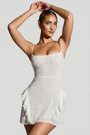 Oh Polly's Priscilla wearing the Domblans Mini Dress in White Embellished fabric perfect for summer parties