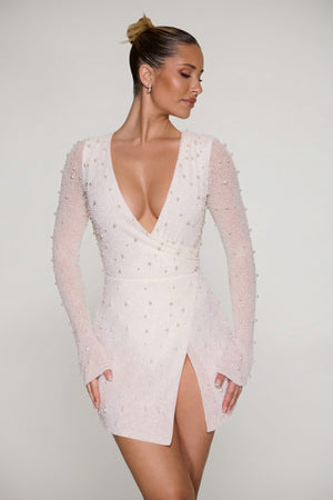 Oh Polly's Sierra Skye wearing the Chelsea Mini Dress in Ivory Embellished fabric perfect for summer garden parties