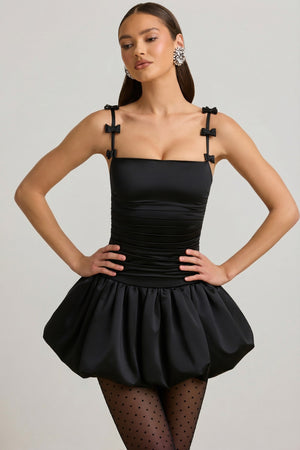Oh Polly's Anna wearing the Cirilla Mini Dress in Black Satin Jersey fabric perfect for special occasions