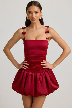 Oh Polly's Anna wearing the Cirilla Mini Dress in True Red Satin Jersey fabric perfect for a romantic dinner date